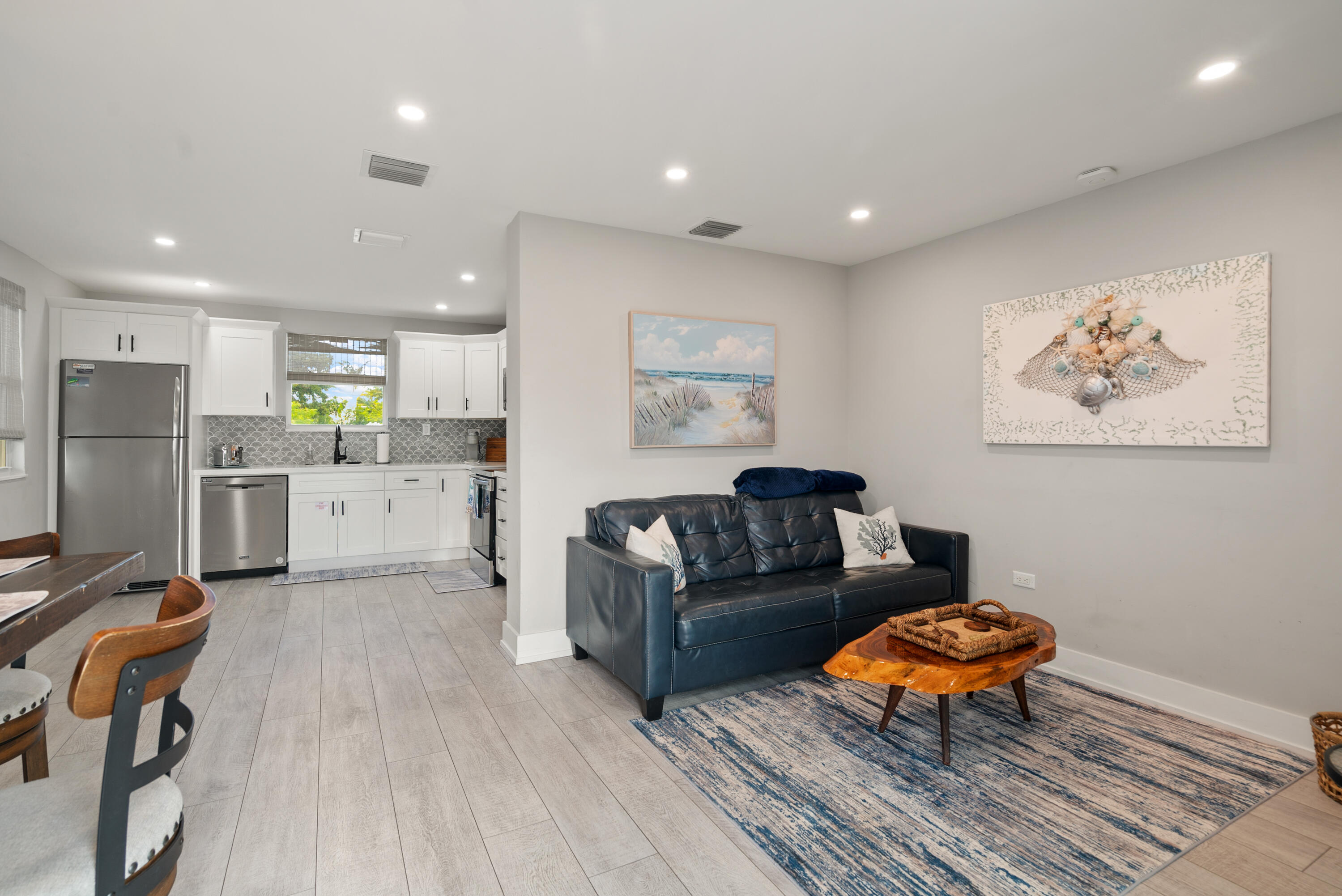 127 Seaside Avenue Key Largo, FL 33037 - Photo 12 of 50 a living room with stainless steel appliances furniture a refrigerator and a view of kitchen