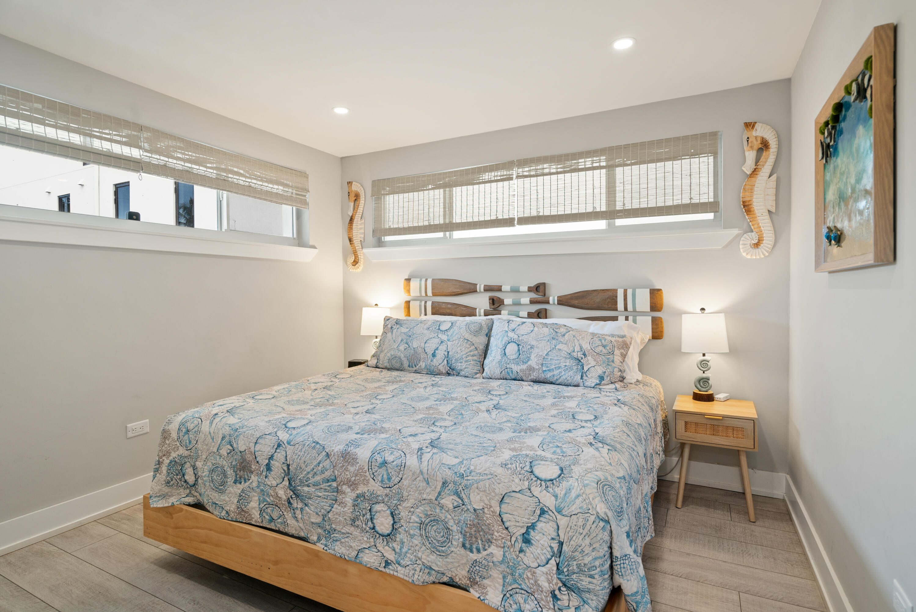 127 Seaside Avenue Key Largo, FL 33037 - Photo 20 of 50 a bedroom with a bed and wooden floor