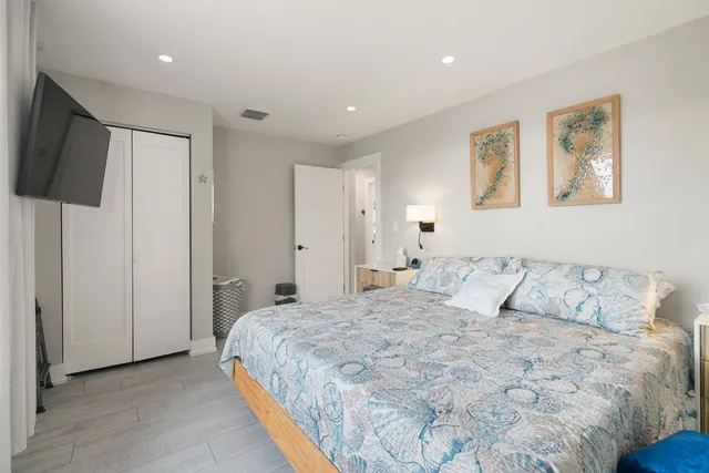 an aerial view of a house with a lake view