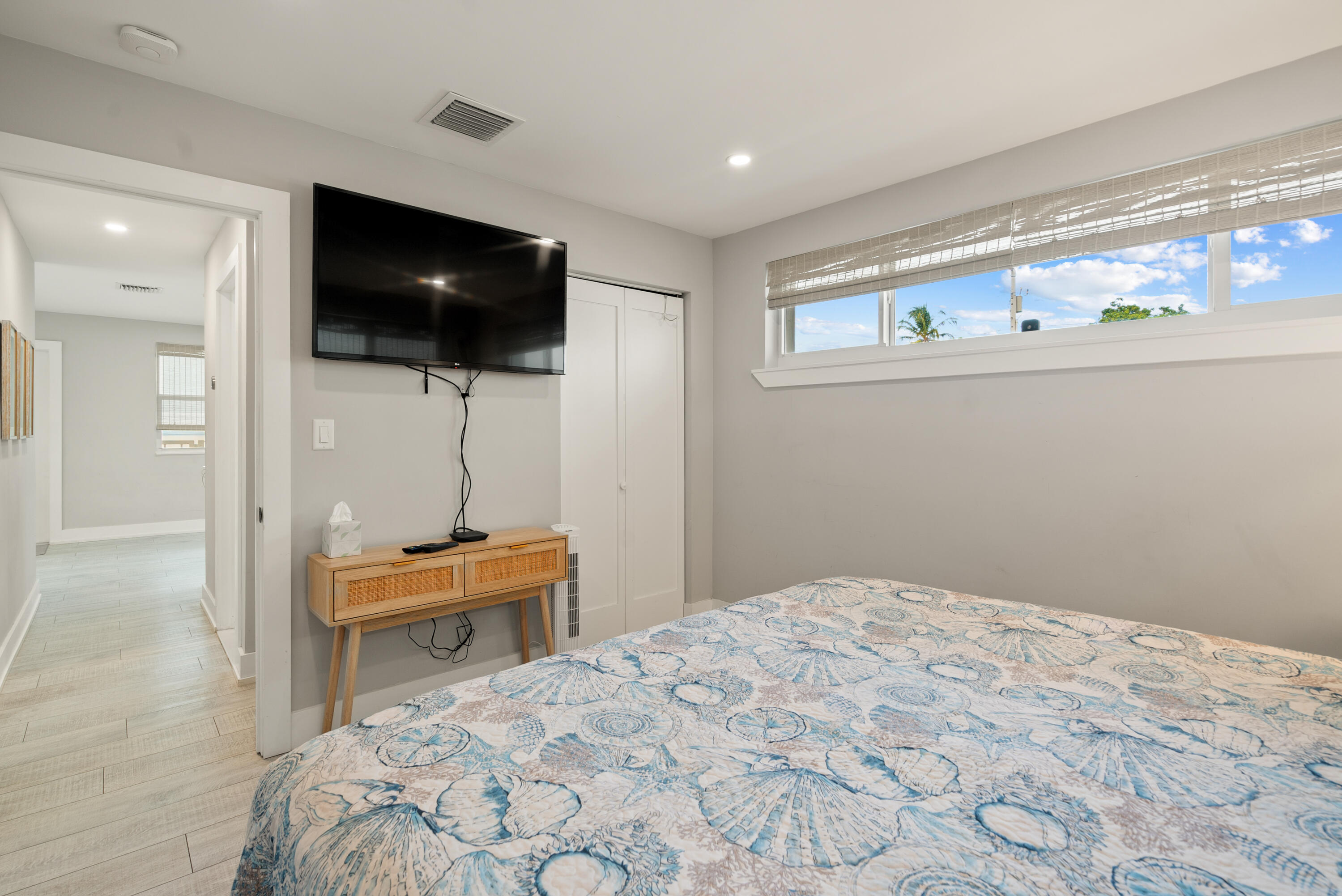 127 Seaside Avenue Key Largo, FL 33037 - Photo 21 of 50 a bedroom with a bed and a flat screen tv