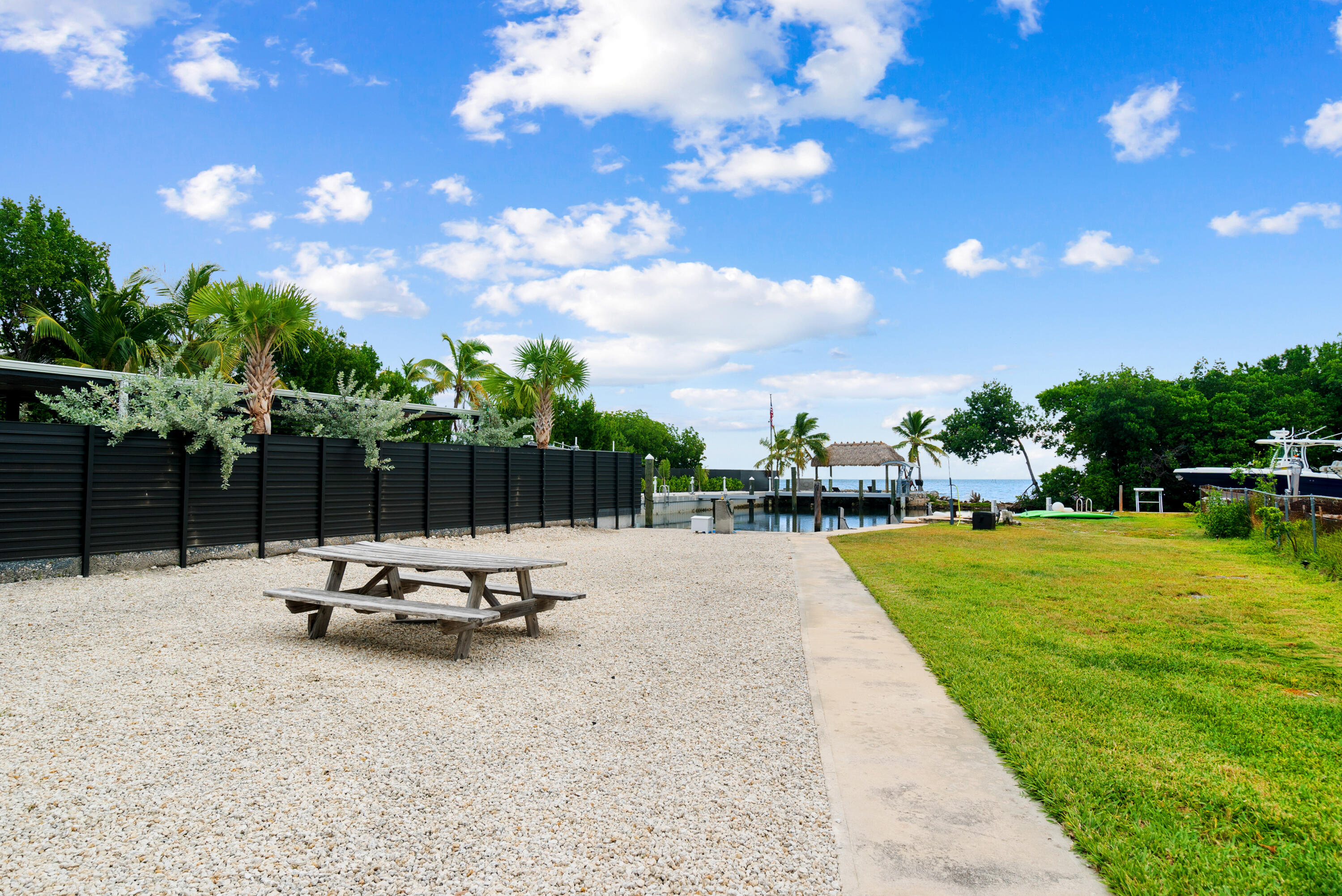 127 Seaside Avenue Key Largo, FL 33037 - Photo 35 of 50 a view of a swimming pool and lounge chairs
