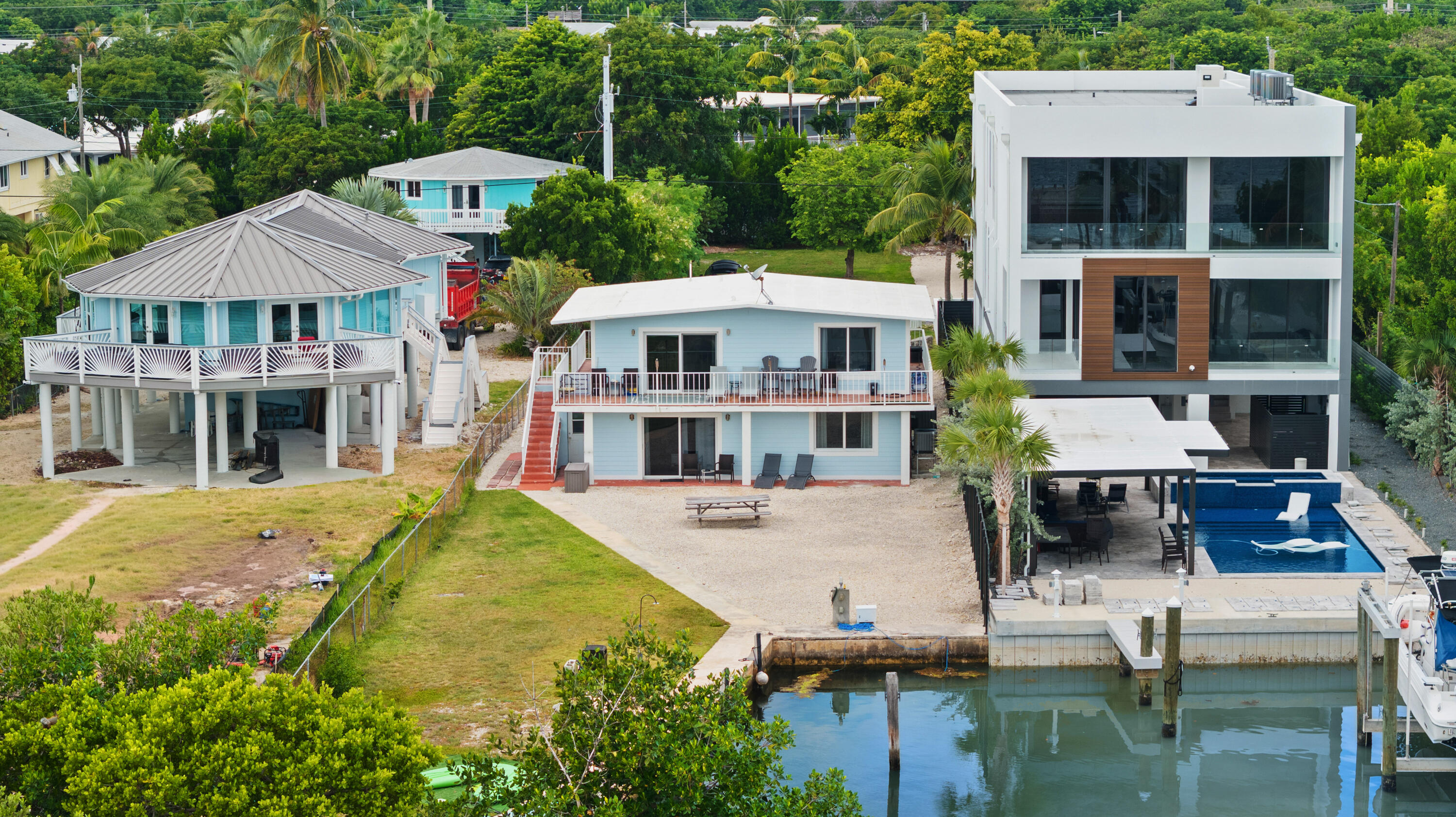 127 Seaside Avenue Key Largo, FL 33037 - Photo 40 of 50 a view of a house with pool and chairs