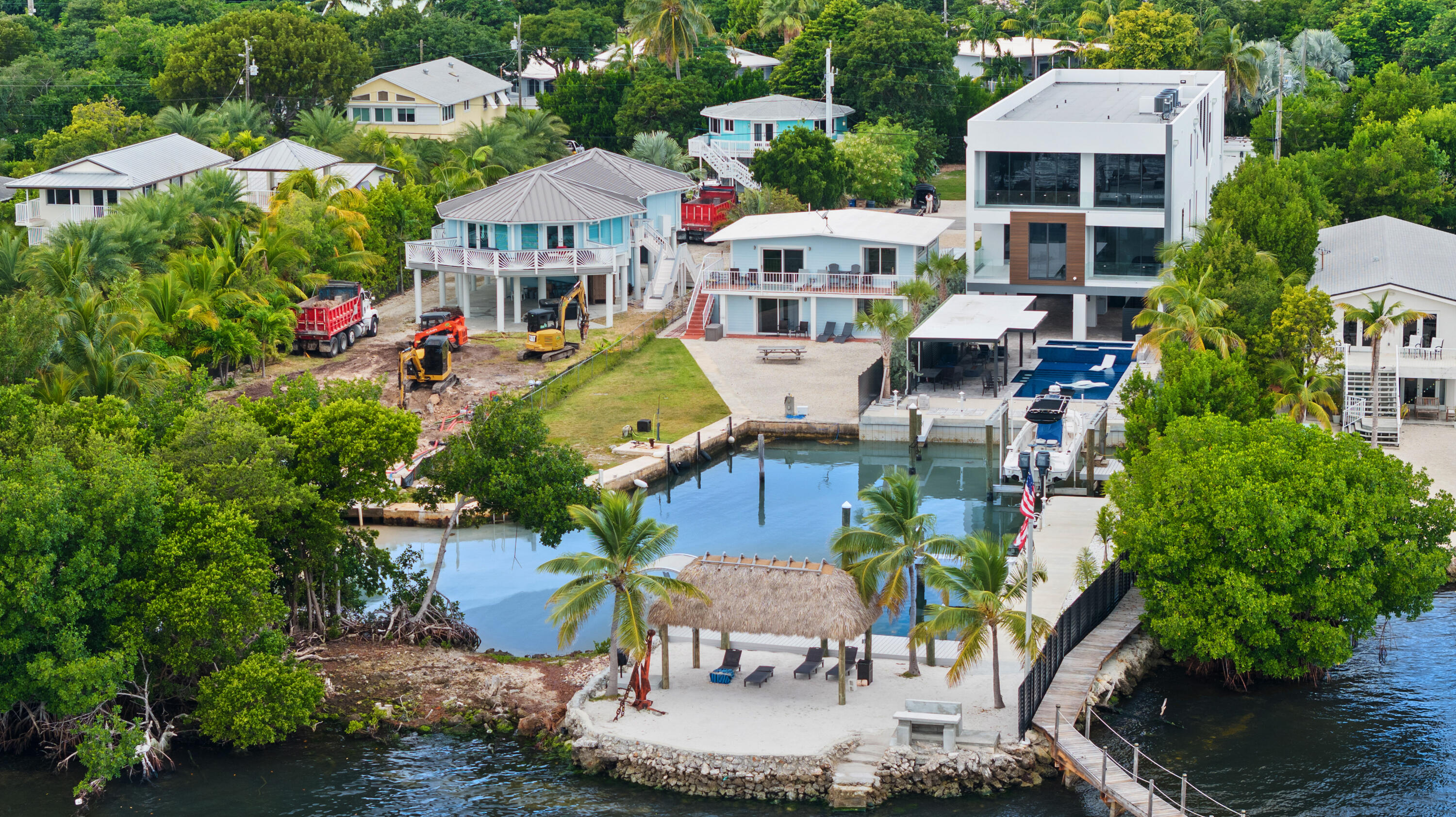 127 Seaside Avenue Key Largo, FL 33037 - Photo 42 of 50 an aerial view of multiple houses with a yard