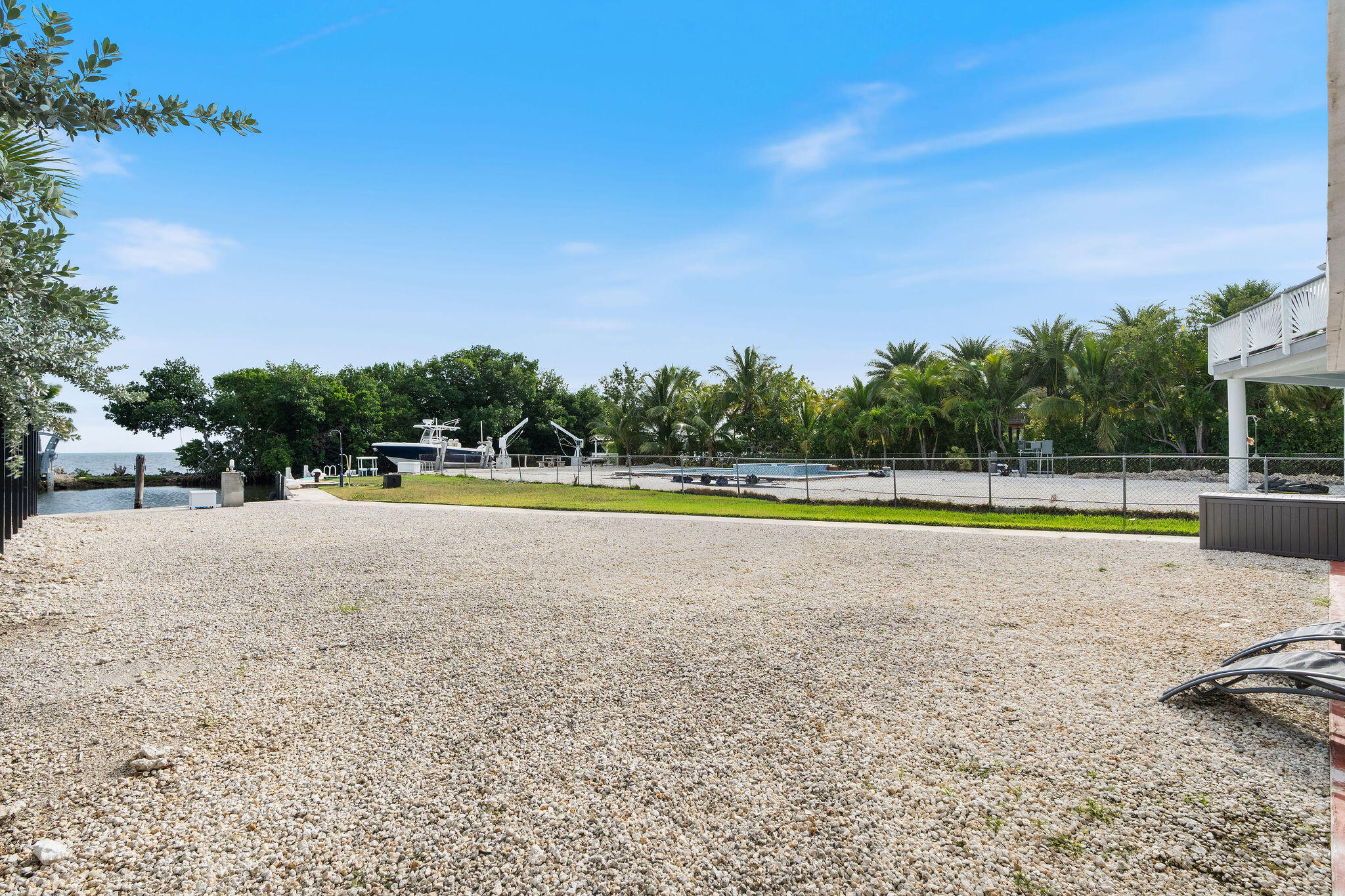 127 Seaside Avenue Key Largo, FL 33037 - Photo 47 of 50 a view of a swimming pool and a yard