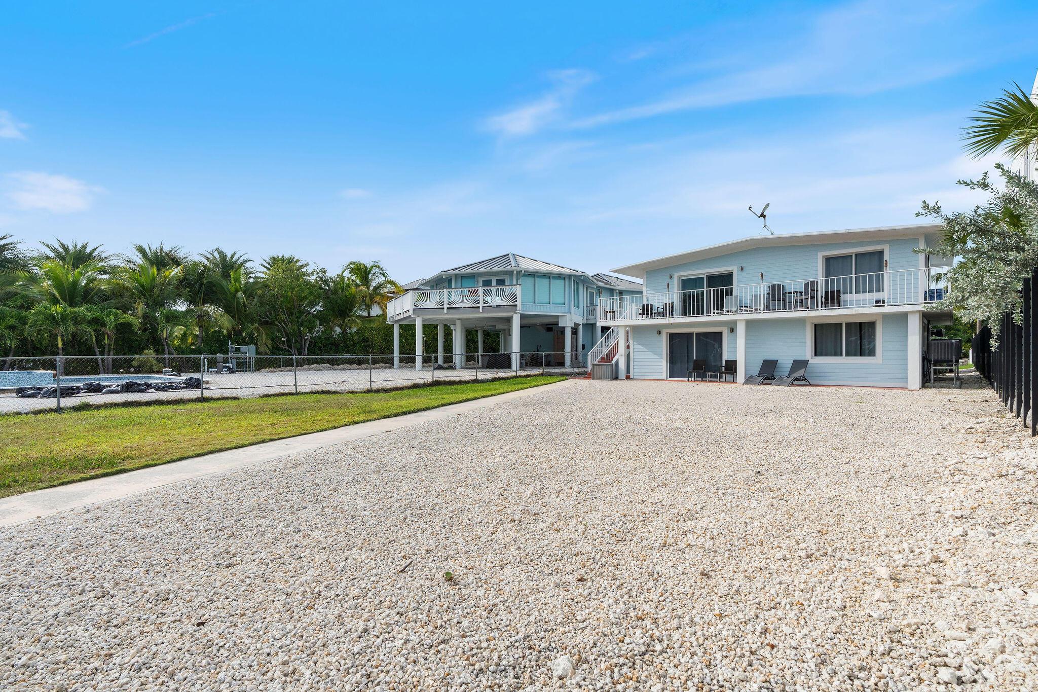 127 Seaside Avenue Key Largo, FL 33037 - Photo 48 of 50 a view of house with a swimming pool