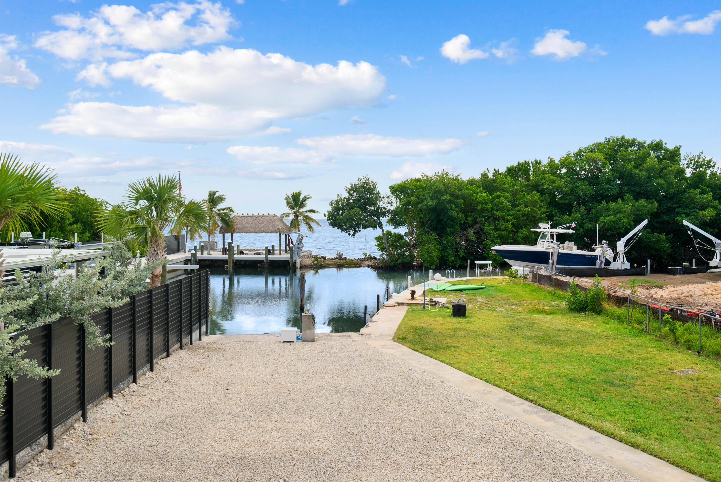 127 Seaside Avenue Key Largo, FL 33037 - Photo 6 of 50 a view of a swimming pool with a patio