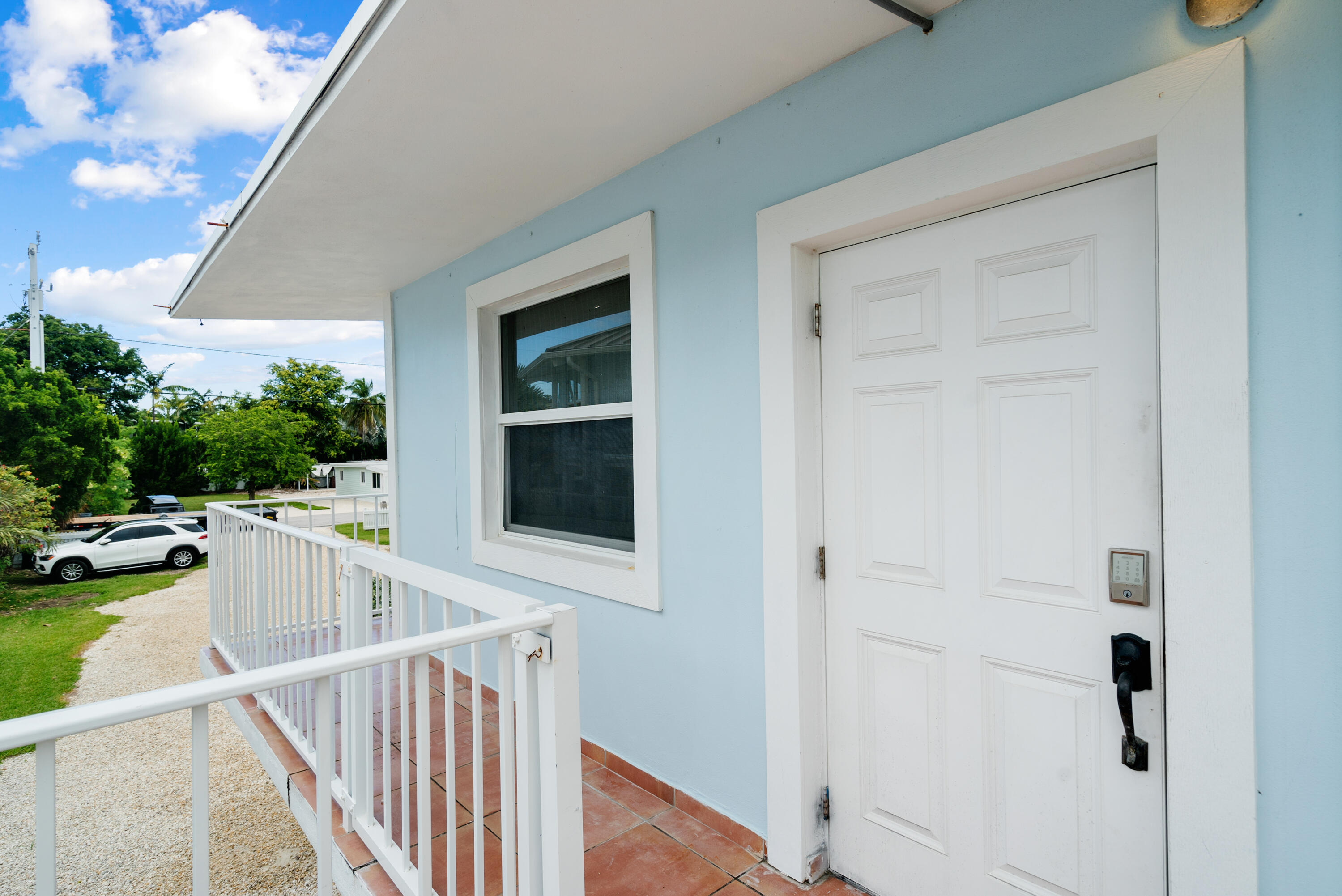127 Seaside Avenue Key Largo, FL 33037 - Photo 7 of 50 a view of a house and a balcony