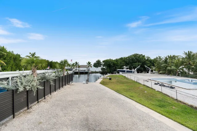 a kitchen with stainless steel appliances a stove microwave and cabinets