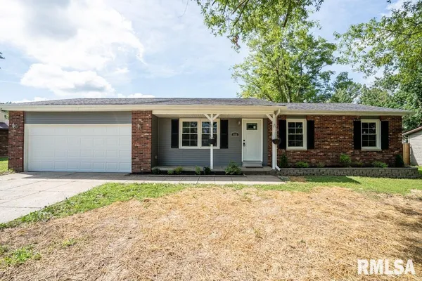 a house with trees in the background