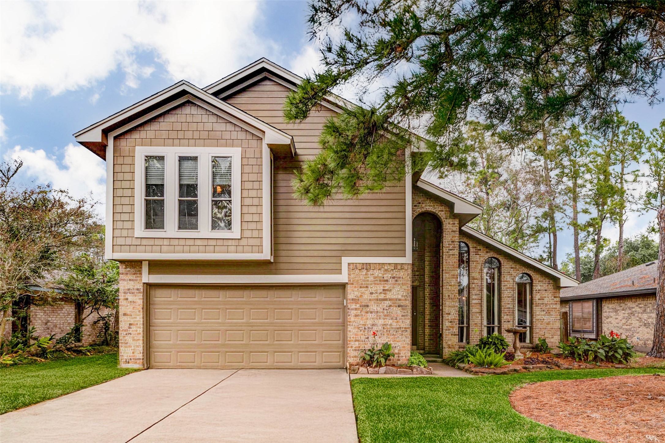 15811 Spring Forest Drive Houston, TX 77059 - Photo 1 of 27 Welcome Home! This charming two-story residence boasts a blend of modern elegance and cozy warmth, featuring a spacious driveway, beautifully landscaped yard, and an inviting exterior that sets the perfect stage for your new beginning.