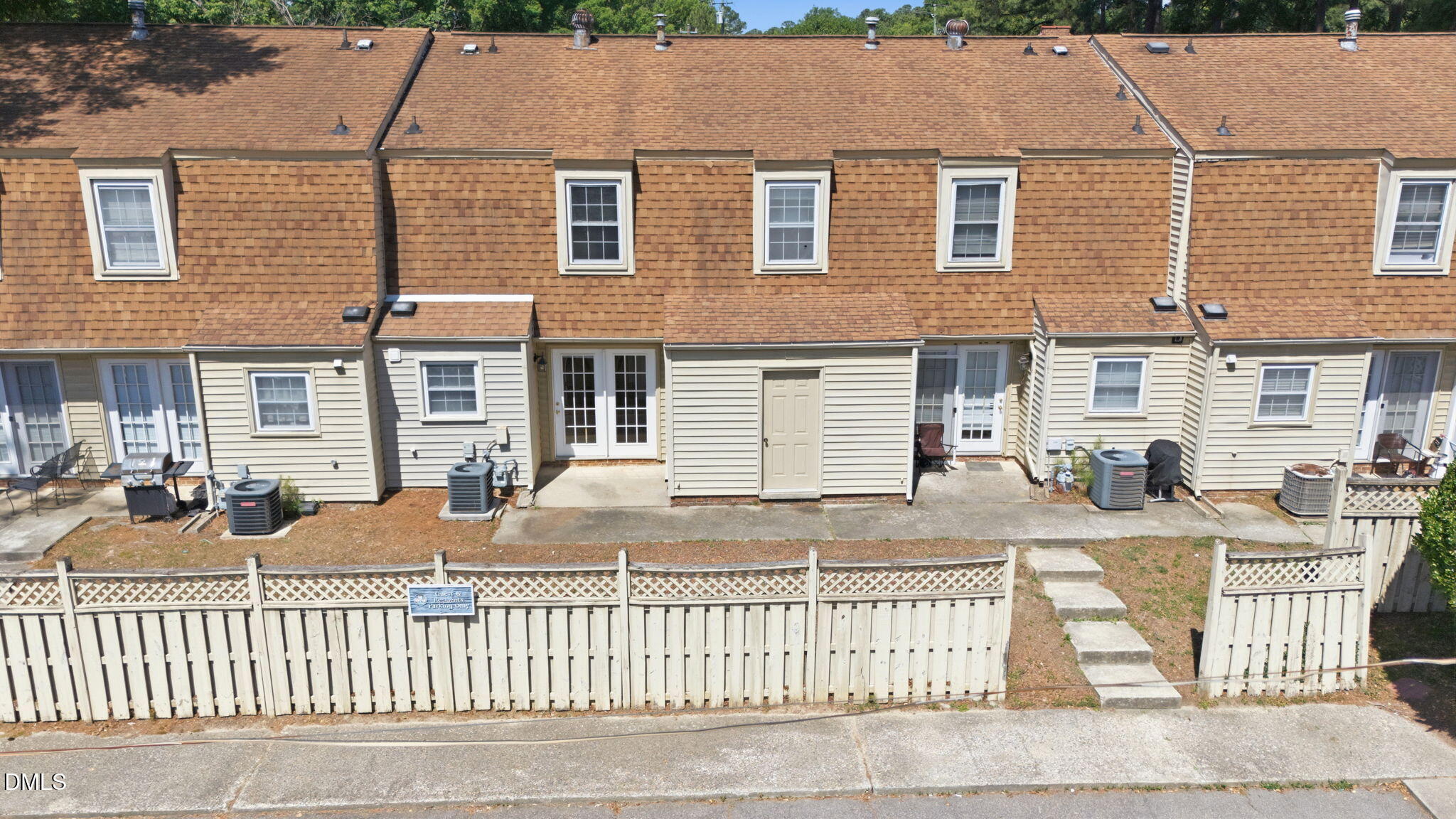 145 Jones Franklin Road, Unit D Raleigh, NC 27606 - Photo 19 of 23 front view of a house with a yard