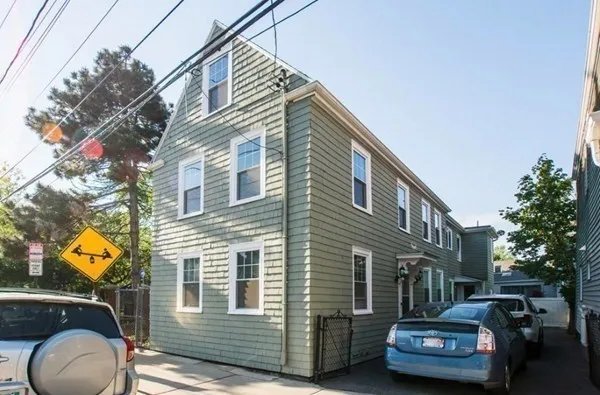 a car parked in front of a house