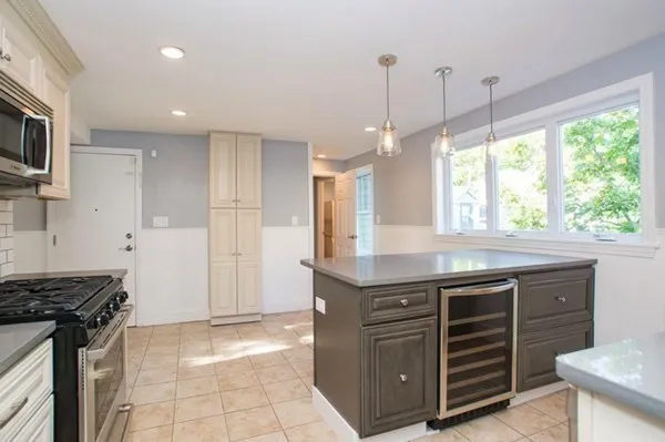 a kitchen with a stove and a sink