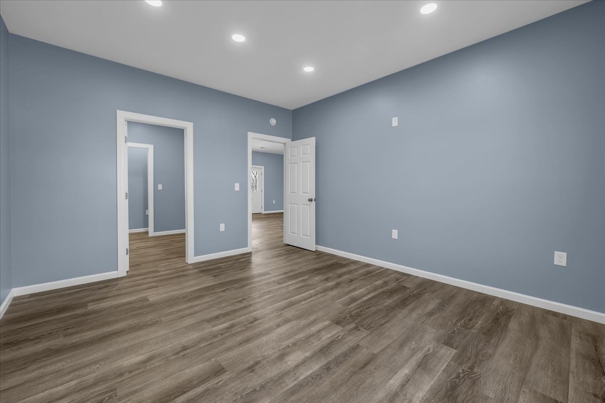 191 Tiffany Lane Decherd, TN 37324 - Photo 12 of 37 a view of an empty room with wooden floor