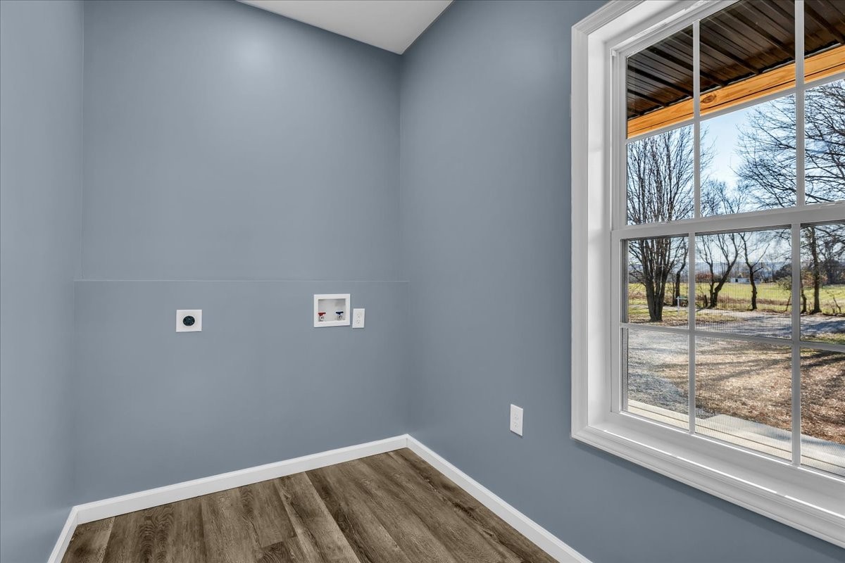 191 Tiffany Lane Decherd, TN 37324 - Photo 20 of 37 a view of room with window and wooden floor