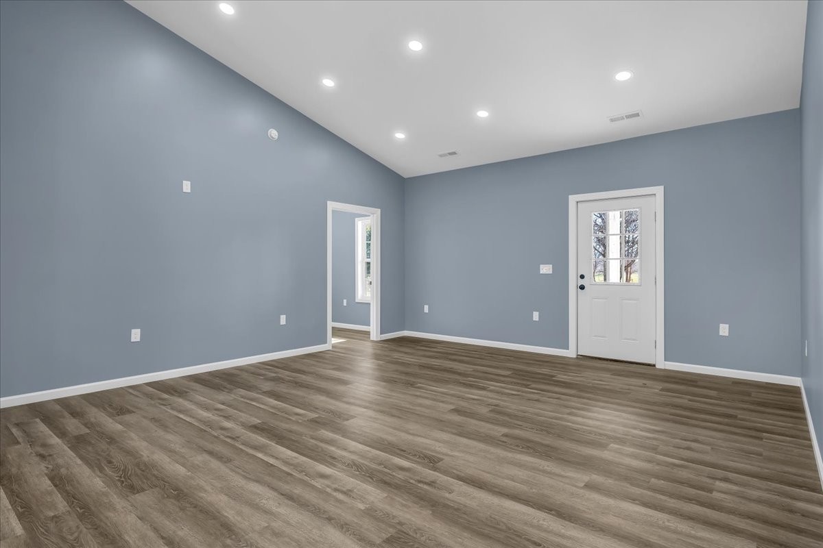 191 Tiffany Lane Decherd, TN 37324 - Photo 6 of 37 a view of an empty room with wooden floor