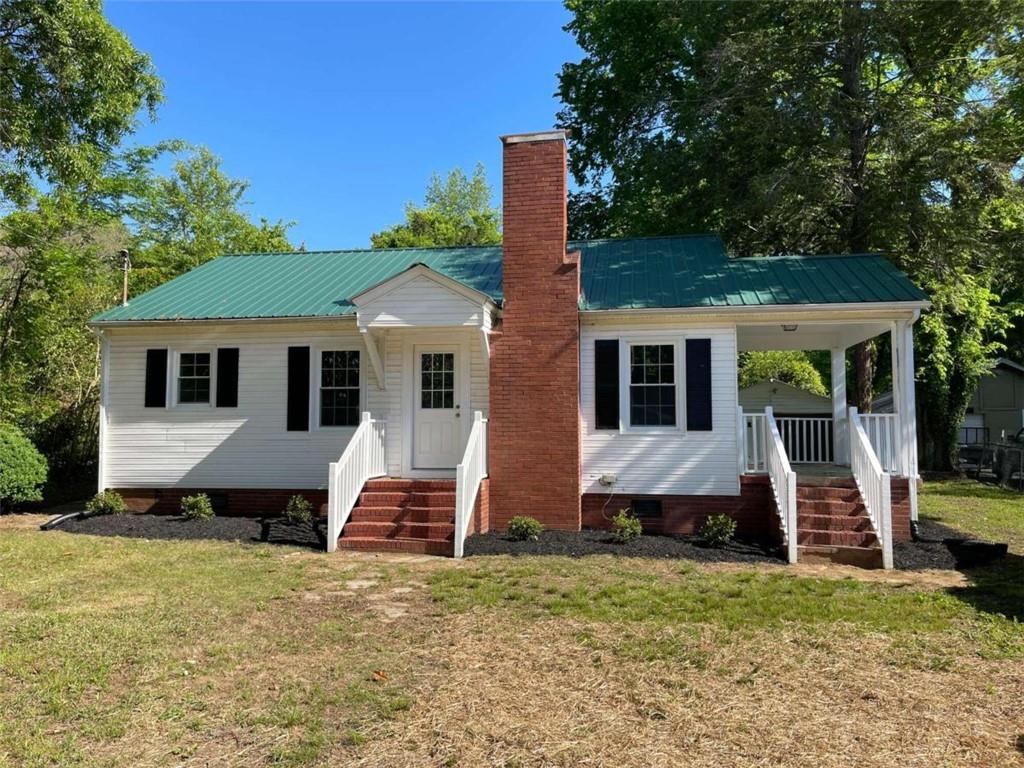 209 East 20th Street Southwest Rome, GA 30161 - Photo 1 of 1 a front view of a house with a yard