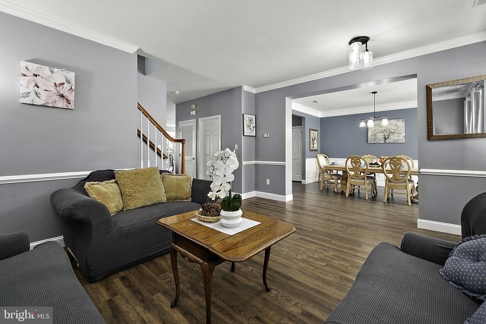 12167 Snug Harbor Road Berlin, MD 21811 - Photo 14 of 107 a living room with furniture and wooden floor