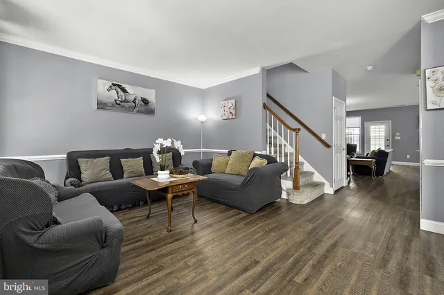 a kitchen with stainless steel appliances granite countertop a stove a microwave and a sink