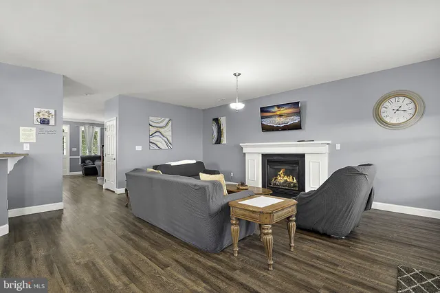 a kitchen with stainless steel appliances a stove microwave and refrigerator