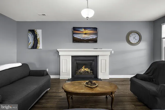 a large bed sitting in a bedroom next to a window