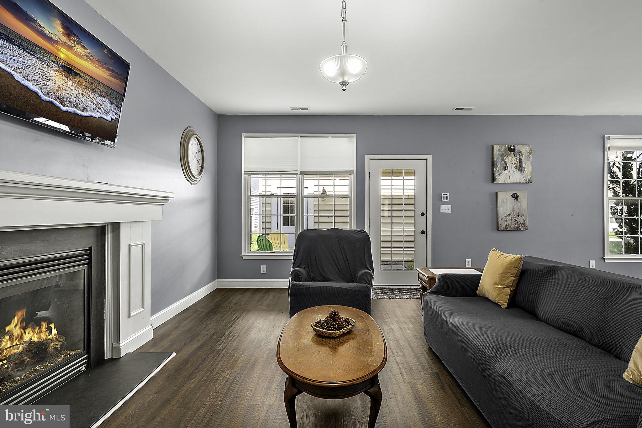 12167 Snug Harbor Road Berlin, MD 21811 - Photo 25 of 107 a living room with furniture and a fireplace