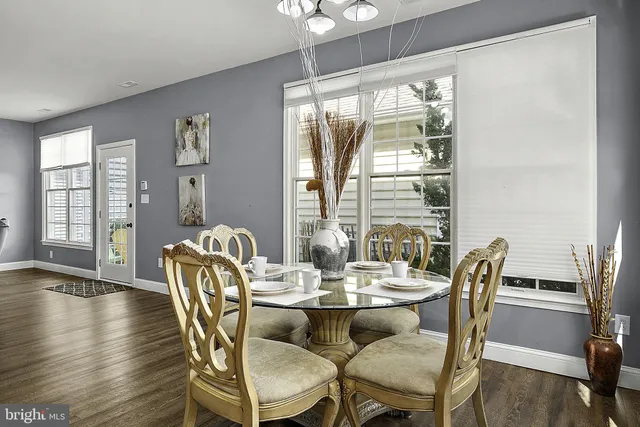 a spacious bedroom with a bed and a large window