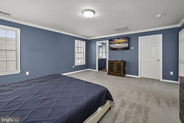a view of a house with garage and yard