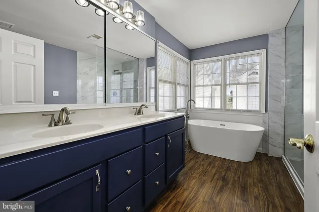 a view of a chair and tables in the back yard of a house