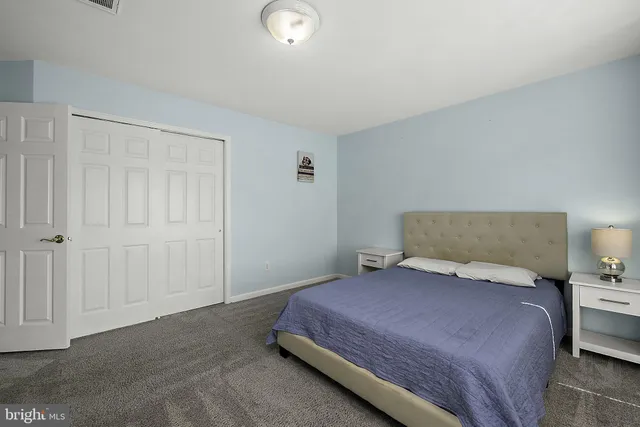 an aerial view of a house with a swimming pool and outdoor seating