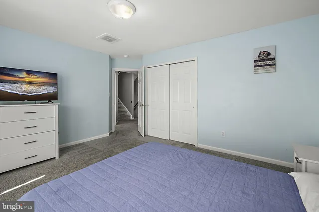 an aerial view of residential houses with outdoor space and swimming pool