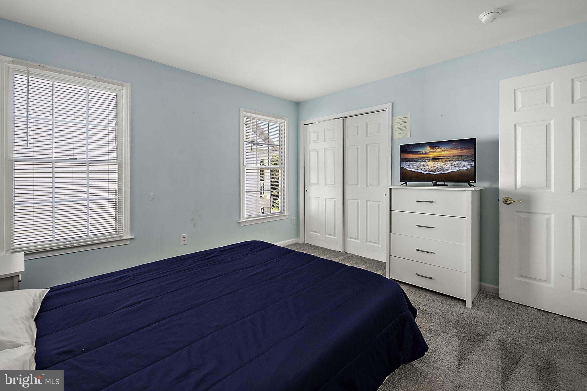 12167 Snug Harbor Road Berlin, MD 21811 - Photo 49 of 107 a bedroom with a bed and furniture