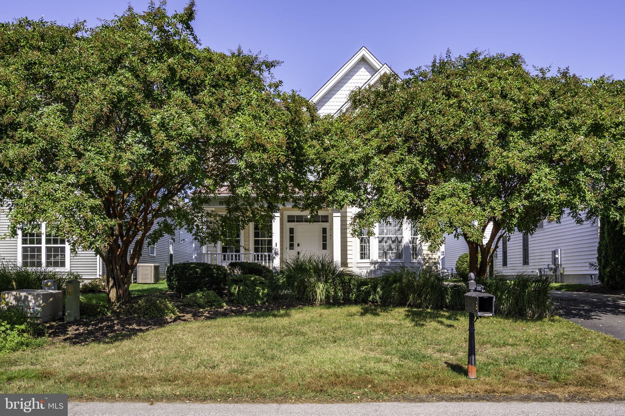 12167 Snug Harbor Road Berlin, MD 21811 - Photo 5 of 107 a front view of a house with garden