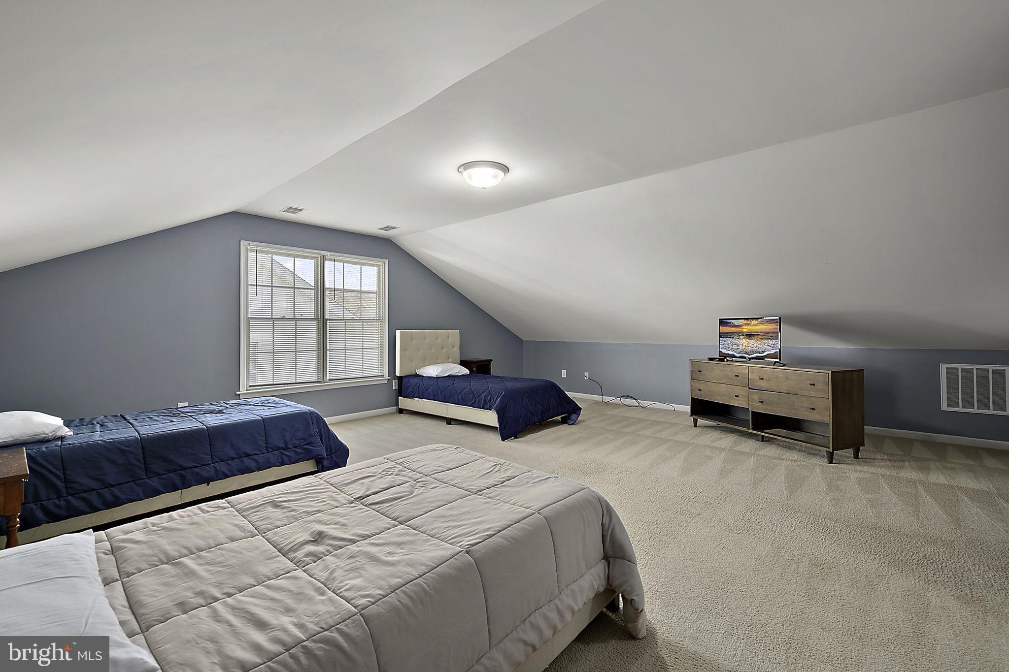 12167 Snug Harbor Road Berlin, MD 21811 - Photo 56 of 107 a bedroom with double bed and a window