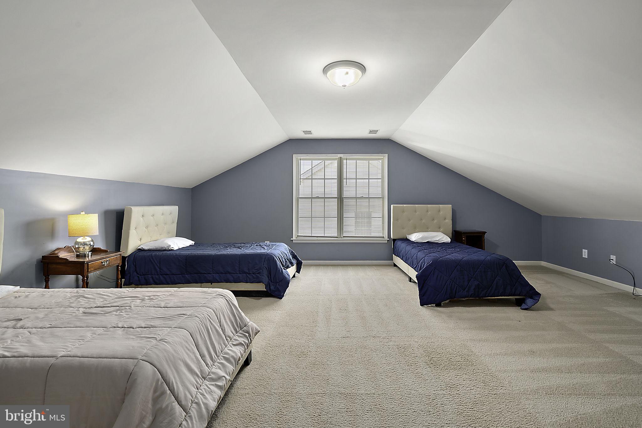 12167 Snug Harbor Road Berlin, MD 21811 - Photo 56 of 107 a spacious bedroom with a bed and a large window