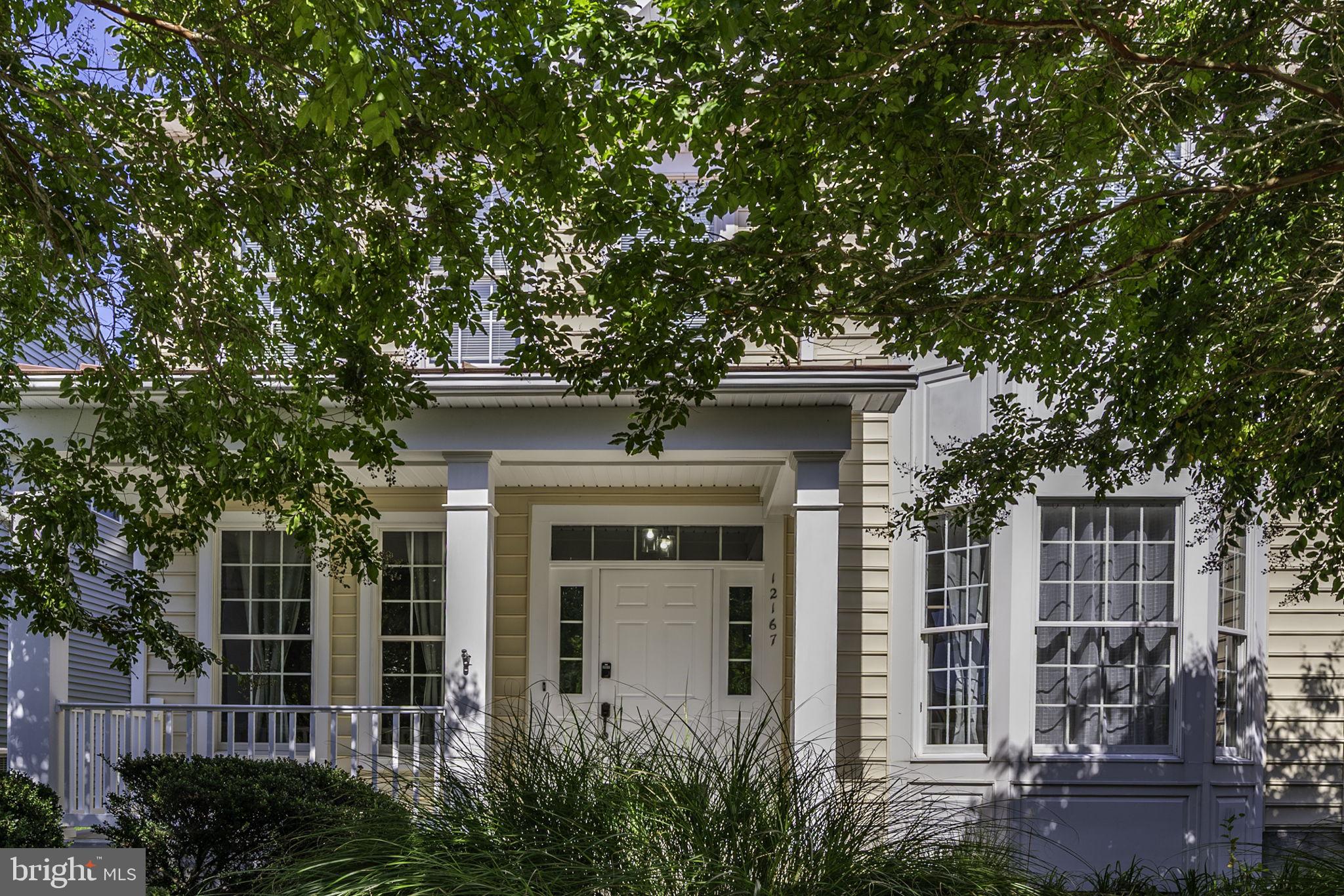 12167 Snug Harbor Road Berlin, MD 21811 - Photo 65 of 107 front view of a house with a tree