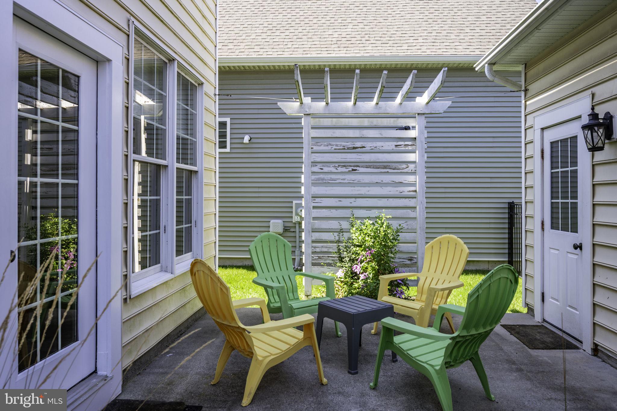 12167 Snug Harbor Road Berlin, MD 21811 - Photo 71 of 107 a view of a chair and table in back of the house