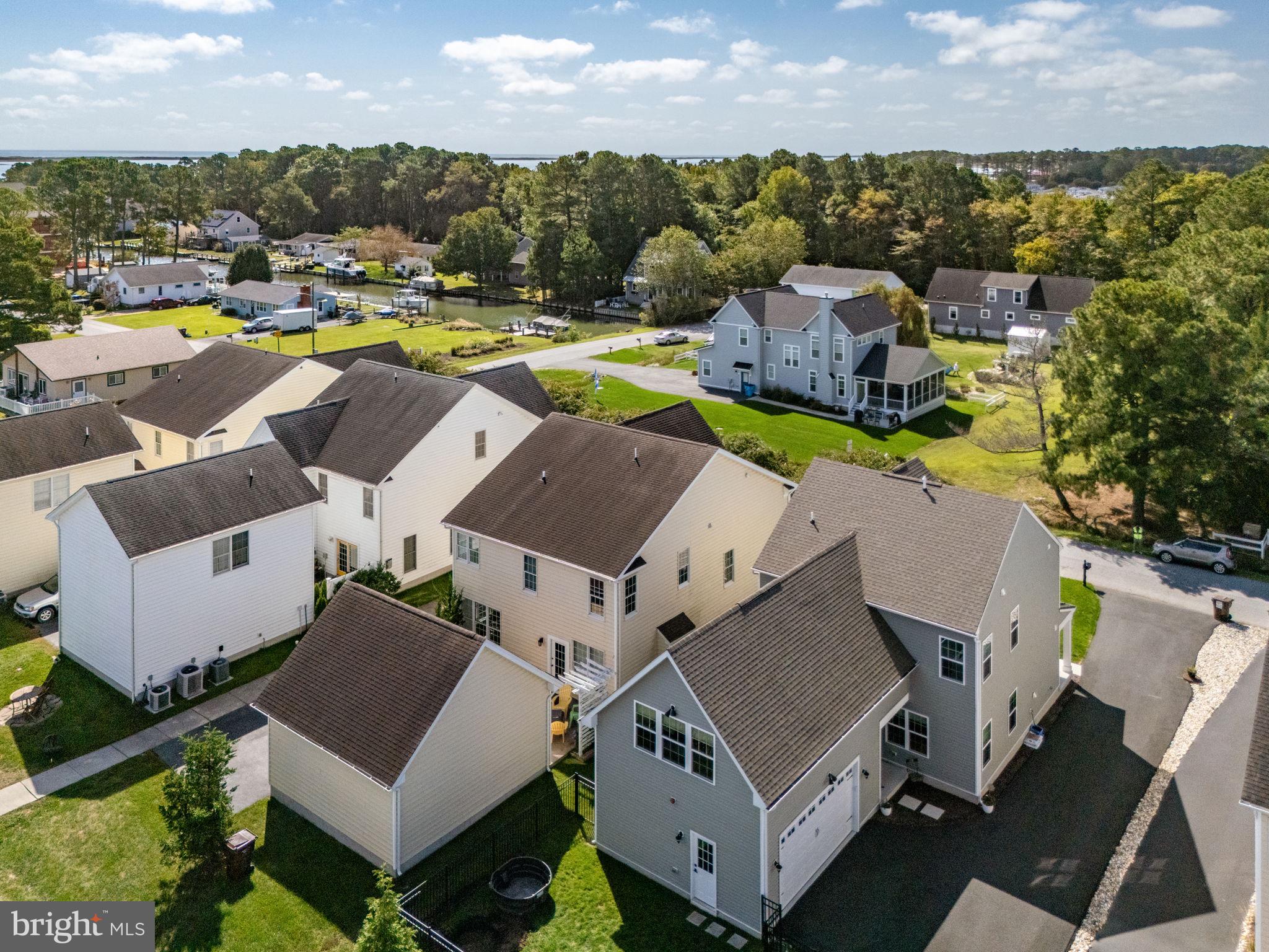 12167 Snug Harbor Road Berlin, MD 21811 - Photo 75 of 107 an aerial view of a house with a swimming pool and outdoor seating