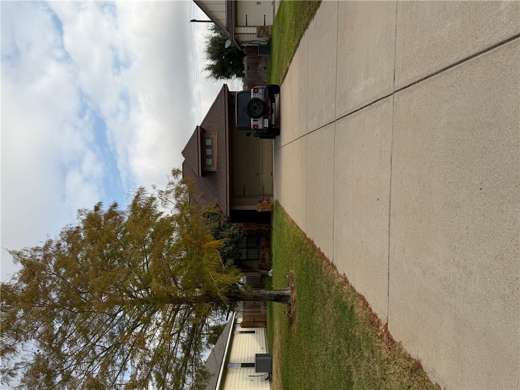 2015 Positano Loop Bryan, TX 77808 - Photo 15 of 15 front view of house with a yard