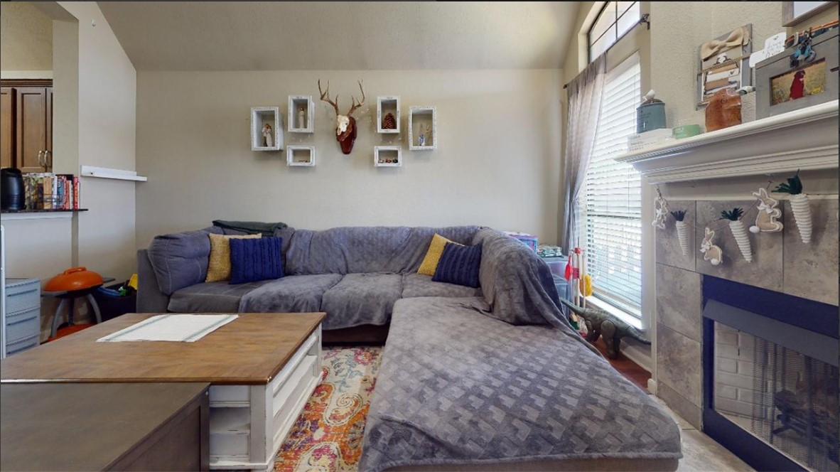2015 Positano Loop Bryan, TX 77808 - Photo 6 of 15 a living room with furniture and a rug