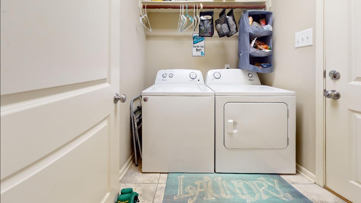 2015 Positano Loop Bryan, TX 77808 - Photo 7 of 15 a utility room with dryer and washer