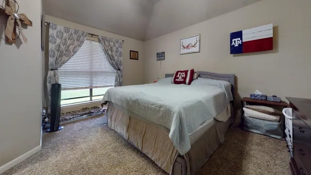 a bathroom with a sink toilet and mirror