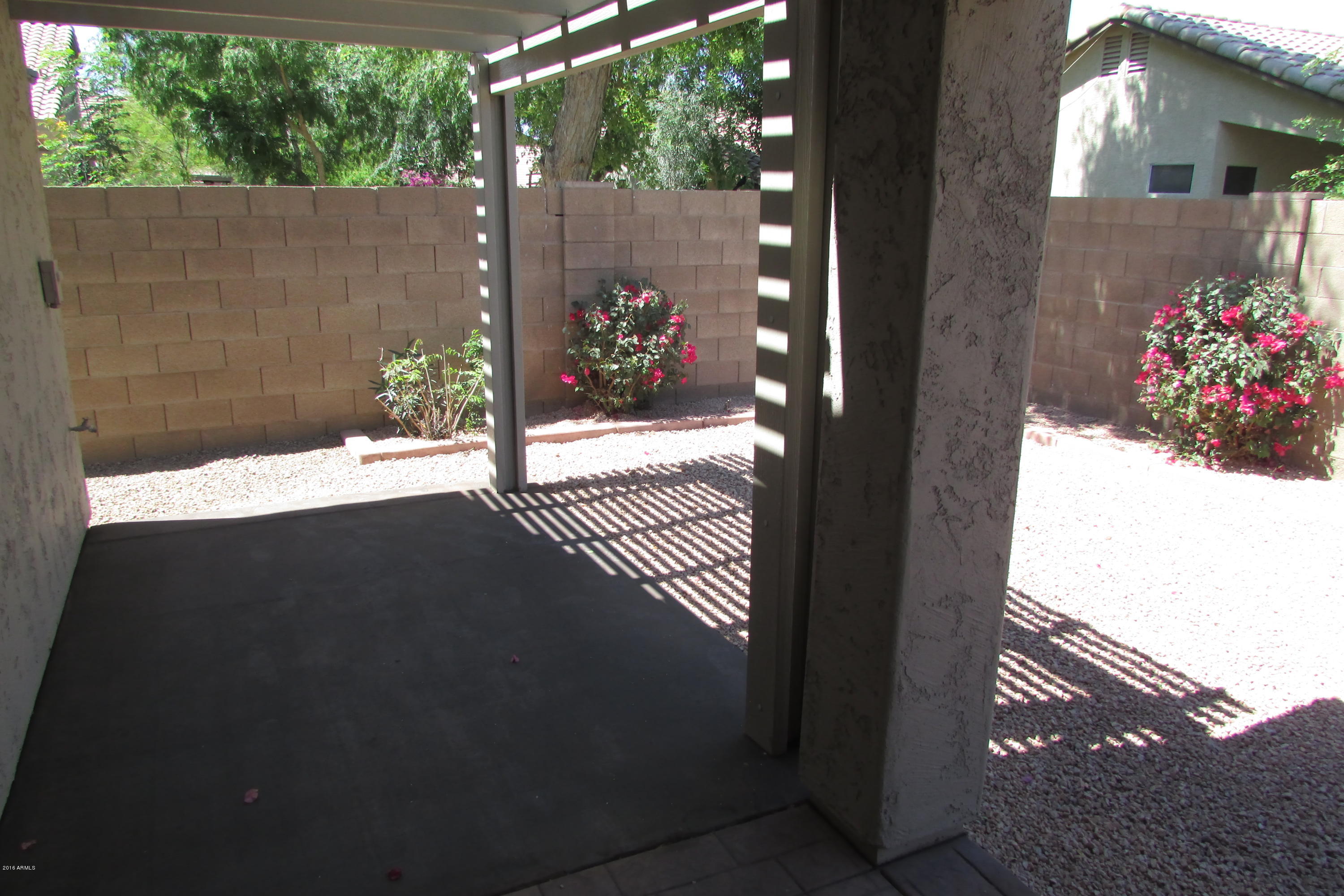 716 East Ranch Road Gilbert, AZ 85296 - Photo 20 of 22 a view of a house with a yard