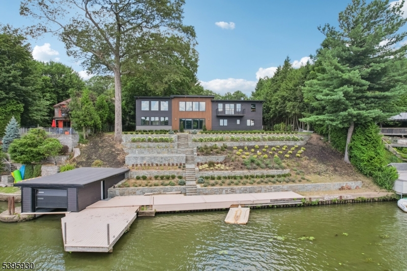 12 Rocky Point Road West Milford, NJ 07421 - Photo 44 of 50 a view of a swimming pool with a patio and a garden