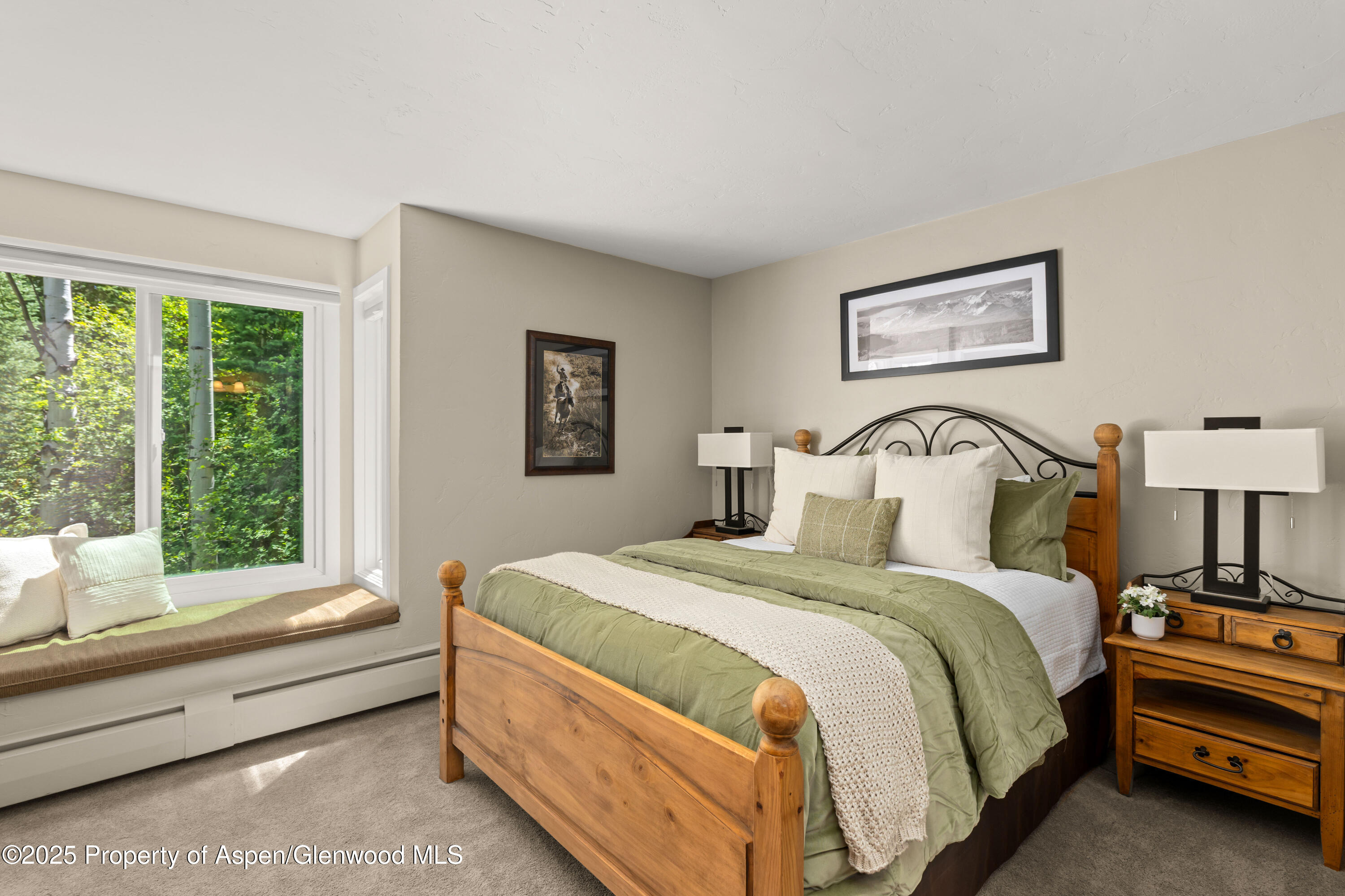 215 Maple Ridge Lane Snowmass Village, CO 81615 - Photo 20 of 30 a bedroom with a bed and a large window