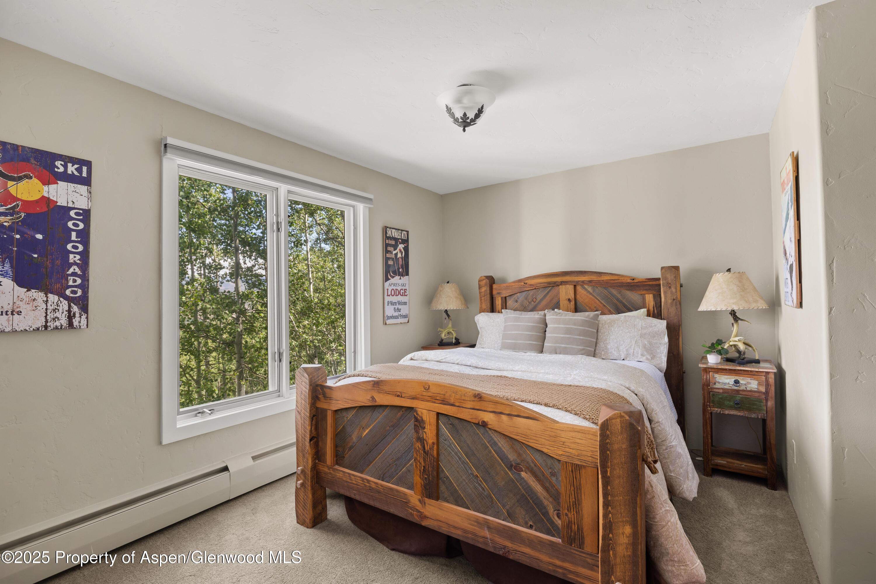 215 Maple Ridge Lane Snowmass Village, CO 81615 - Photo 22 of 30 a bedroom with a bed and a window
