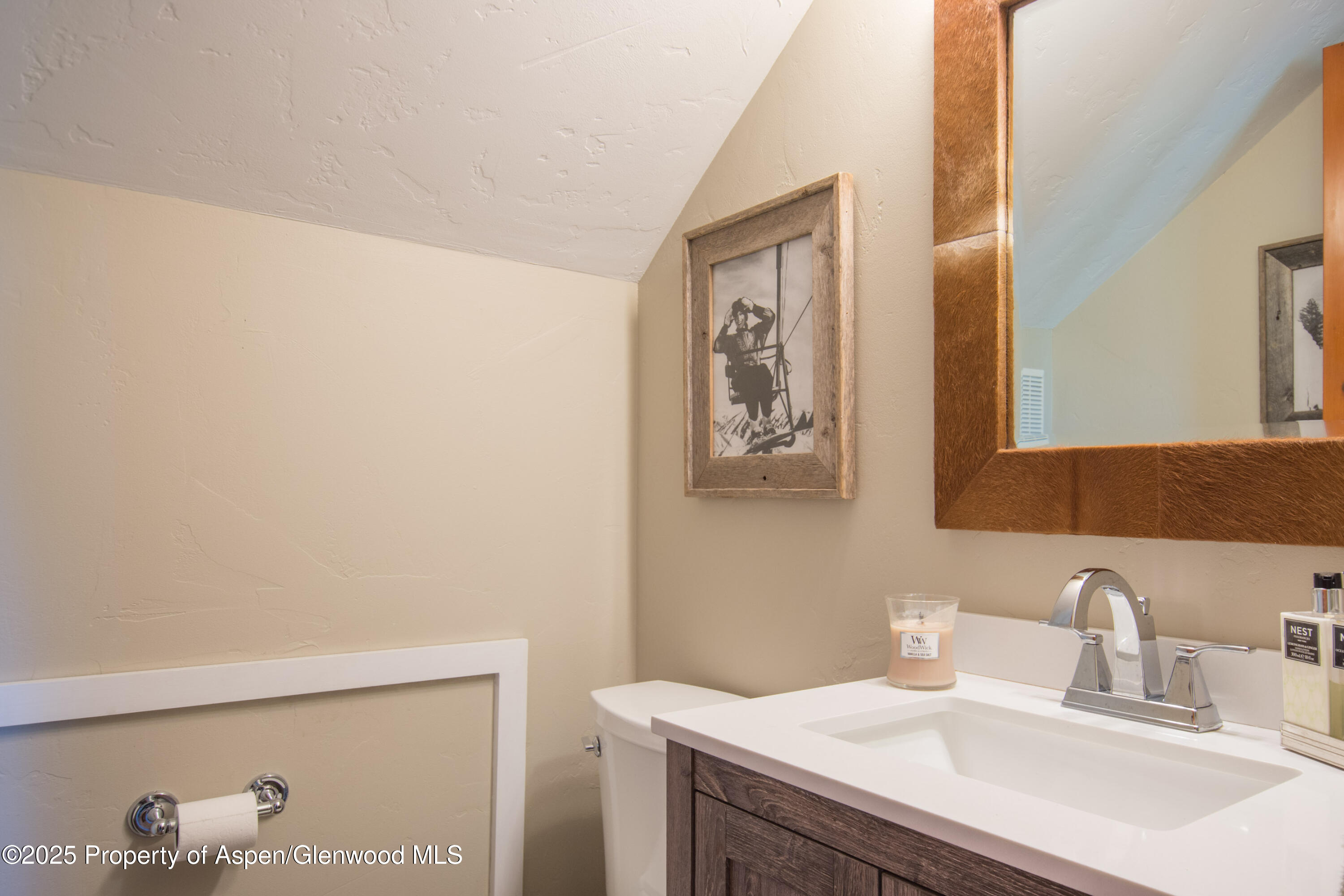215 Maple Ridge Lane Snowmass Village, CO 81615 - Photo 25 of 30 a bathroom with a sink and a mirror