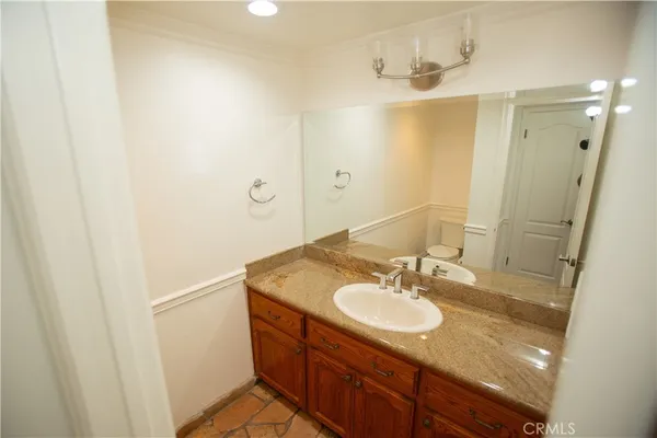 a bathroom with a sink double vanity and a mirror