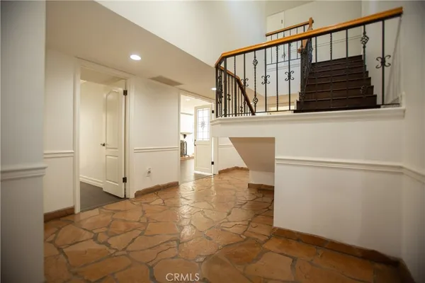a view of a hallway with staircase