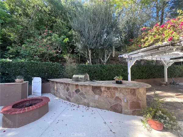 a view of a backyard with sitting area